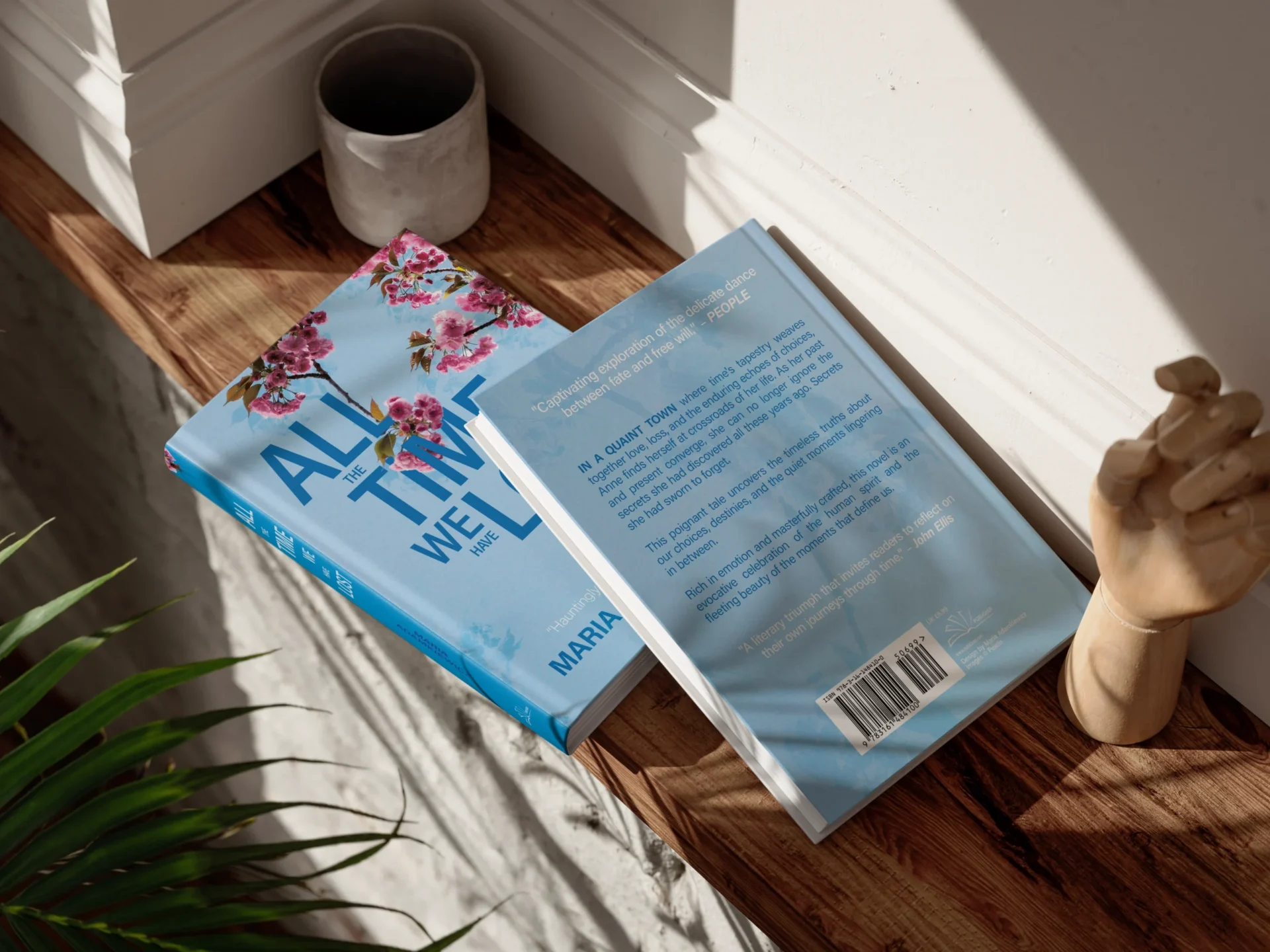 Two books with a title 'All the time we have lost' lying on a shelf, showing their front and back cover.