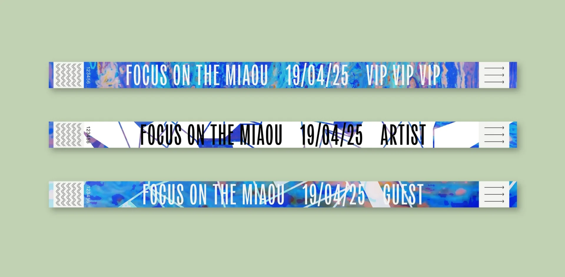 Paper entrance bracelets marked with bright-colored textures and different captions.