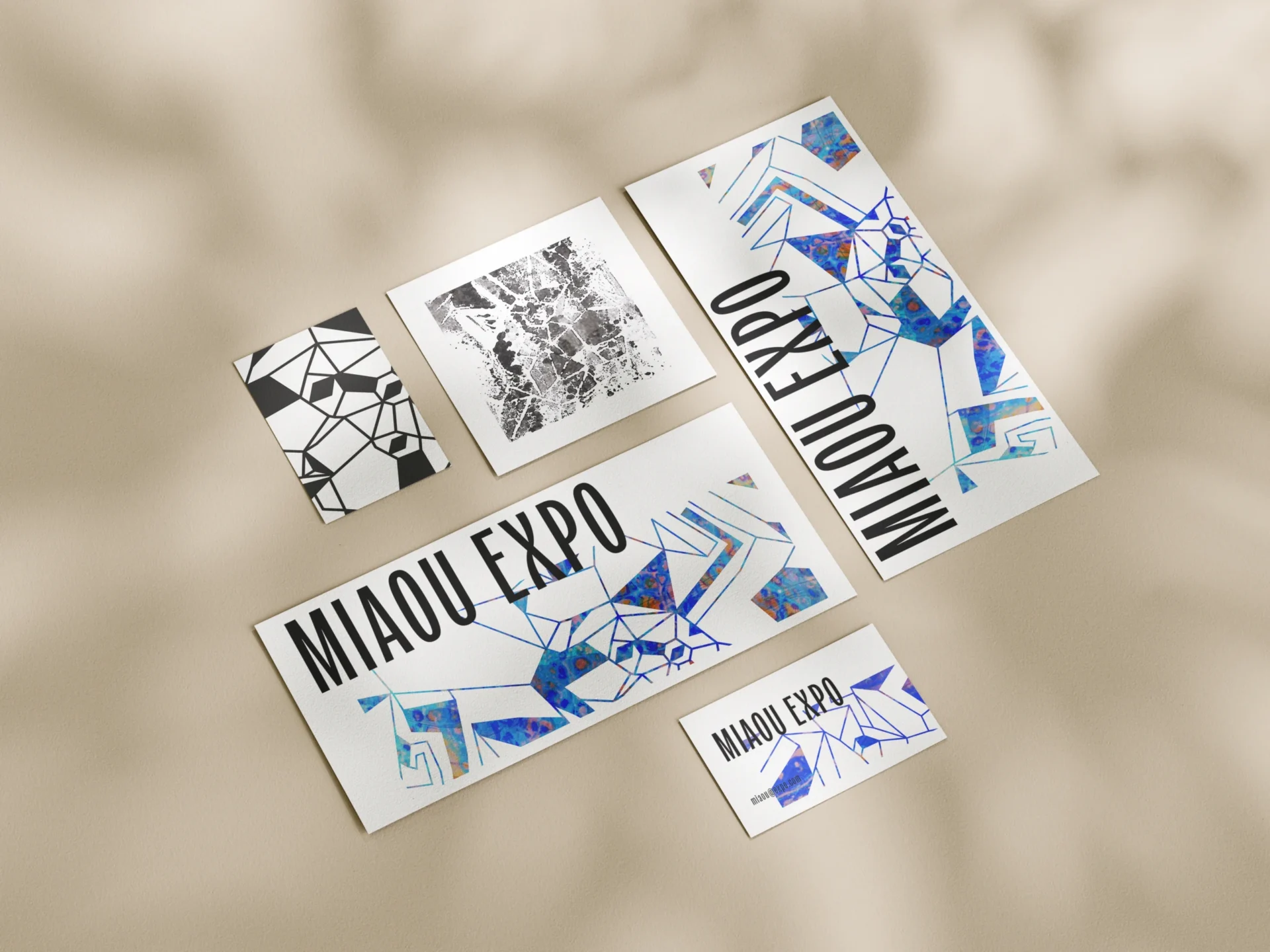 Various stationary materials based on the 'Miaou Expo' poster illustration.