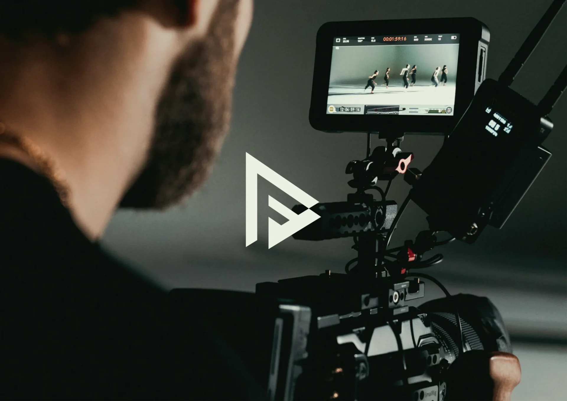 In the foreground, there is a logo of a Gen-Z company called 'Power Frame Studio' and in the background, a man operating a camera.