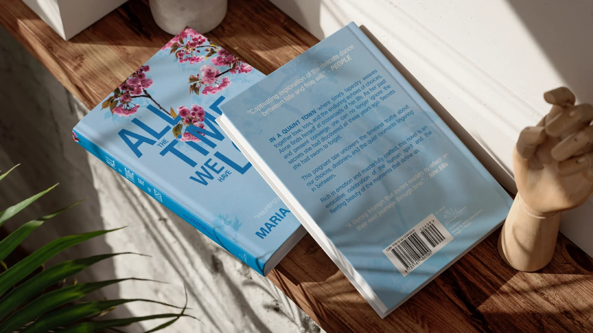 Two books with a title 'All the time we have lost' lying on a shelf, showing their front and back cover.