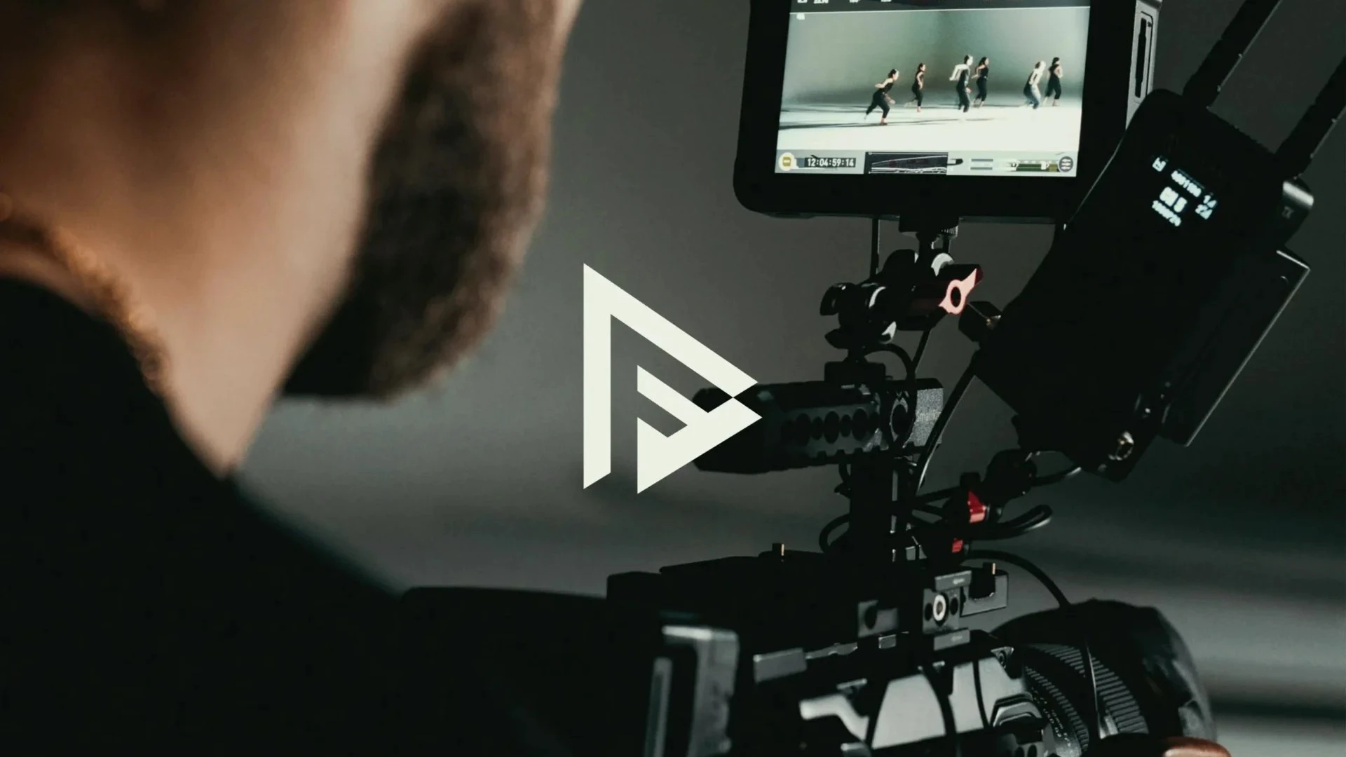 In the foreground, there is a logo of a Gen-Z company called 'Power Frame Studio' and in the background, a man operating a camera.